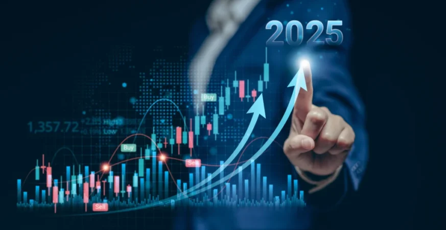 Businessman pointing at a digital financial graph showing upward investment trends for the year 2025