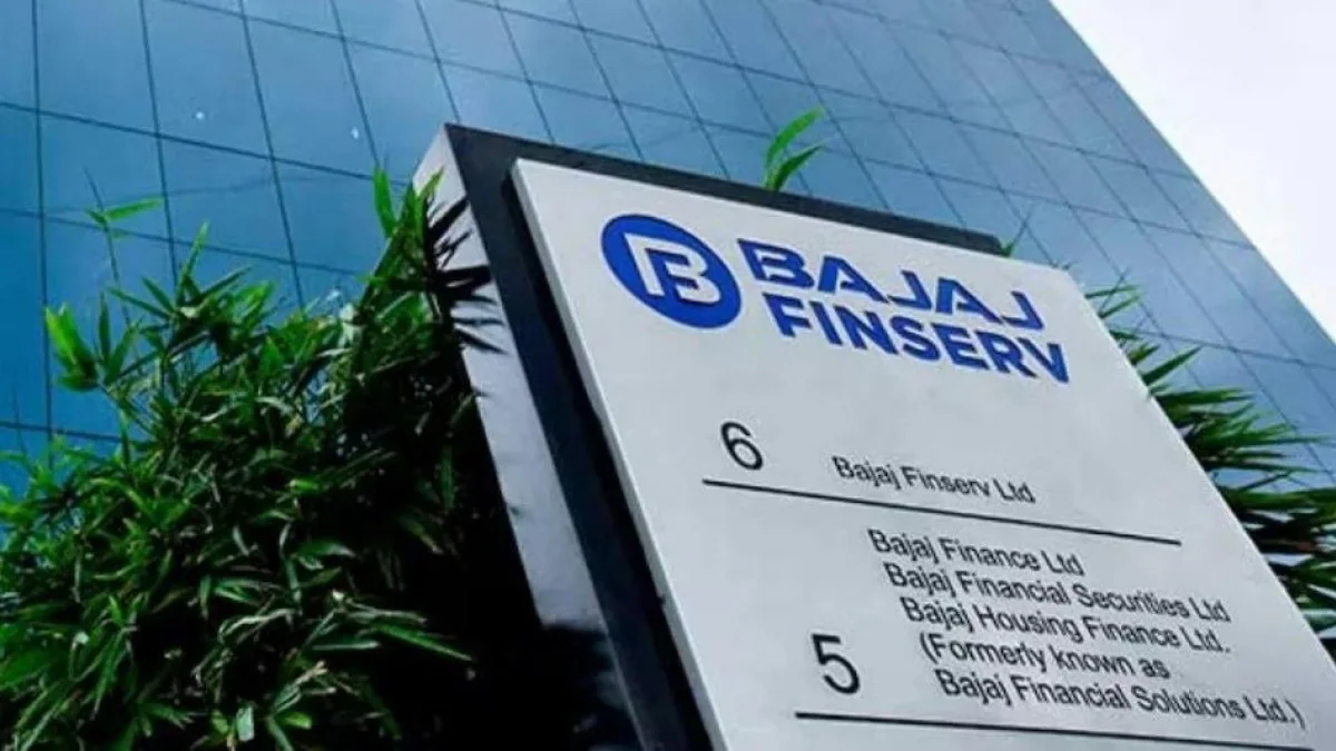 Bajaj Finserv headquarters signage with greenery and modern glass building in background.