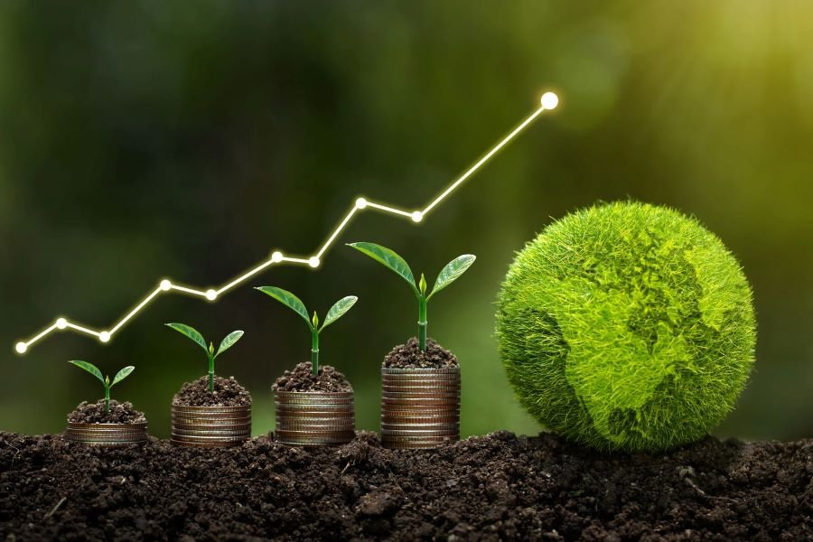 Stacks of coins with small plants growing on top, representing sustainable financial growth, with a green globe symbolizing eco-conscious investment.